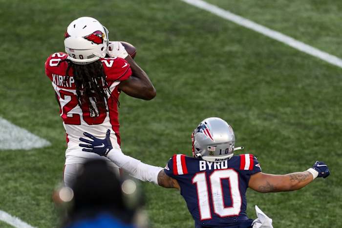 Arizona Cardinals cornerback Dre Kirkpatrick (20) intercepts a pass against the New England Patriots. Mandatory Credit: Paul Rutherford-USA TODAY